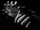 "Black And White Guitar Playing Edited 2020" by chocolatedazzles is licensed under CC BY 2.0