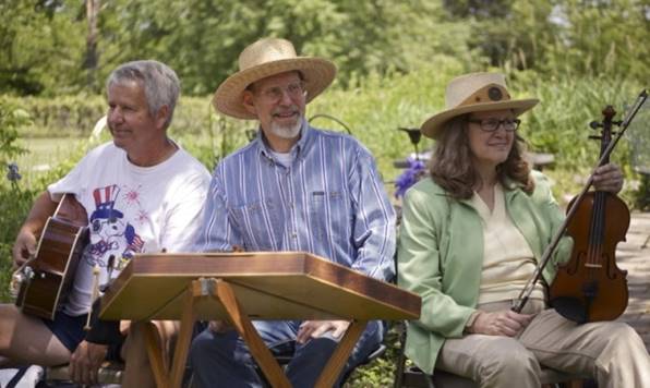 The Kishwaukee Ramblers include Neal Brown, Gary Plazyk, and Amy Beth (L to R). They play traditional American and Celtic folk music and children's songs using guitar, fiddle, cello, banjo, autoharp, mandolin, mountain dulcimer, hammered dulcimer, Anglo concertinas, hurdy gurdy, didgeridoo, jaw harp, and other musical toys.